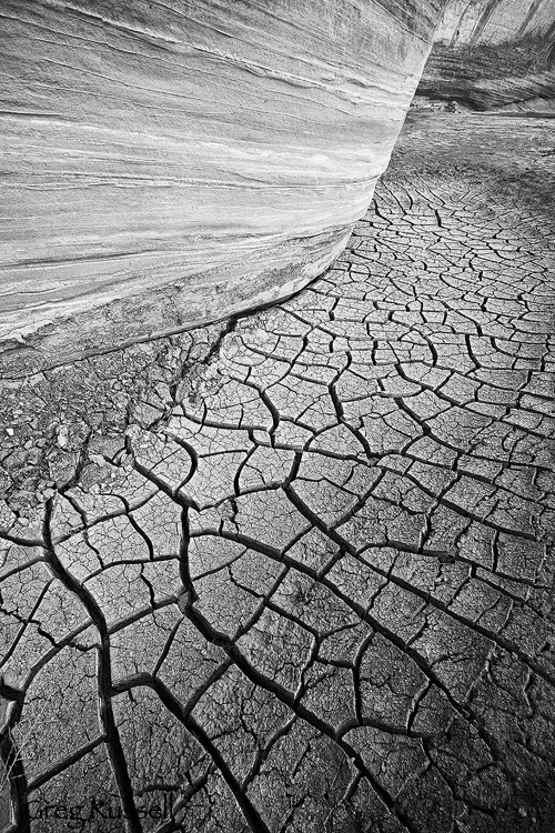 Cracking mud and sandstone wall along the Paria River in southern Utah